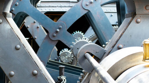 inside of a factory showing gears and cogs