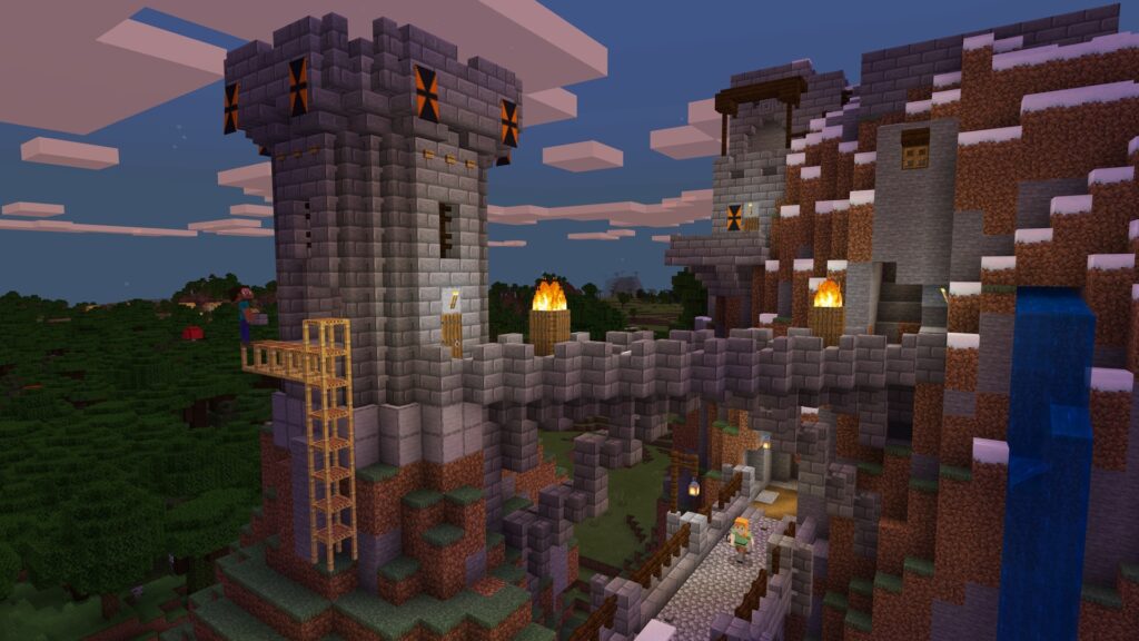 A stone brick tower being built by Steve and Alex walking on a bridge below.