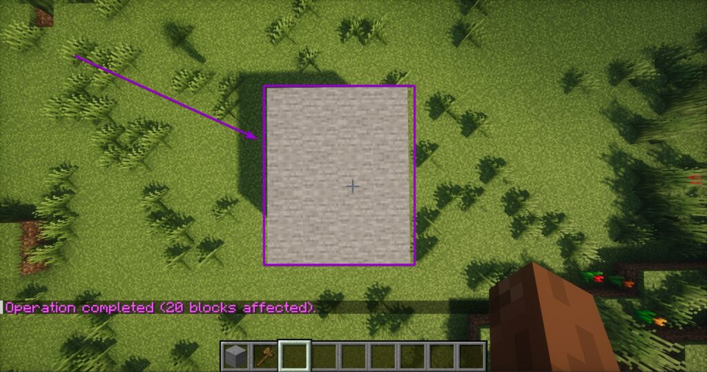 Top-down view of the completed square area instantly filled with stone blocks after using the set command