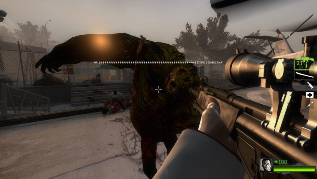 First-person view in Left 4 Dead 2 showing a text-based floating health bar above a Tank